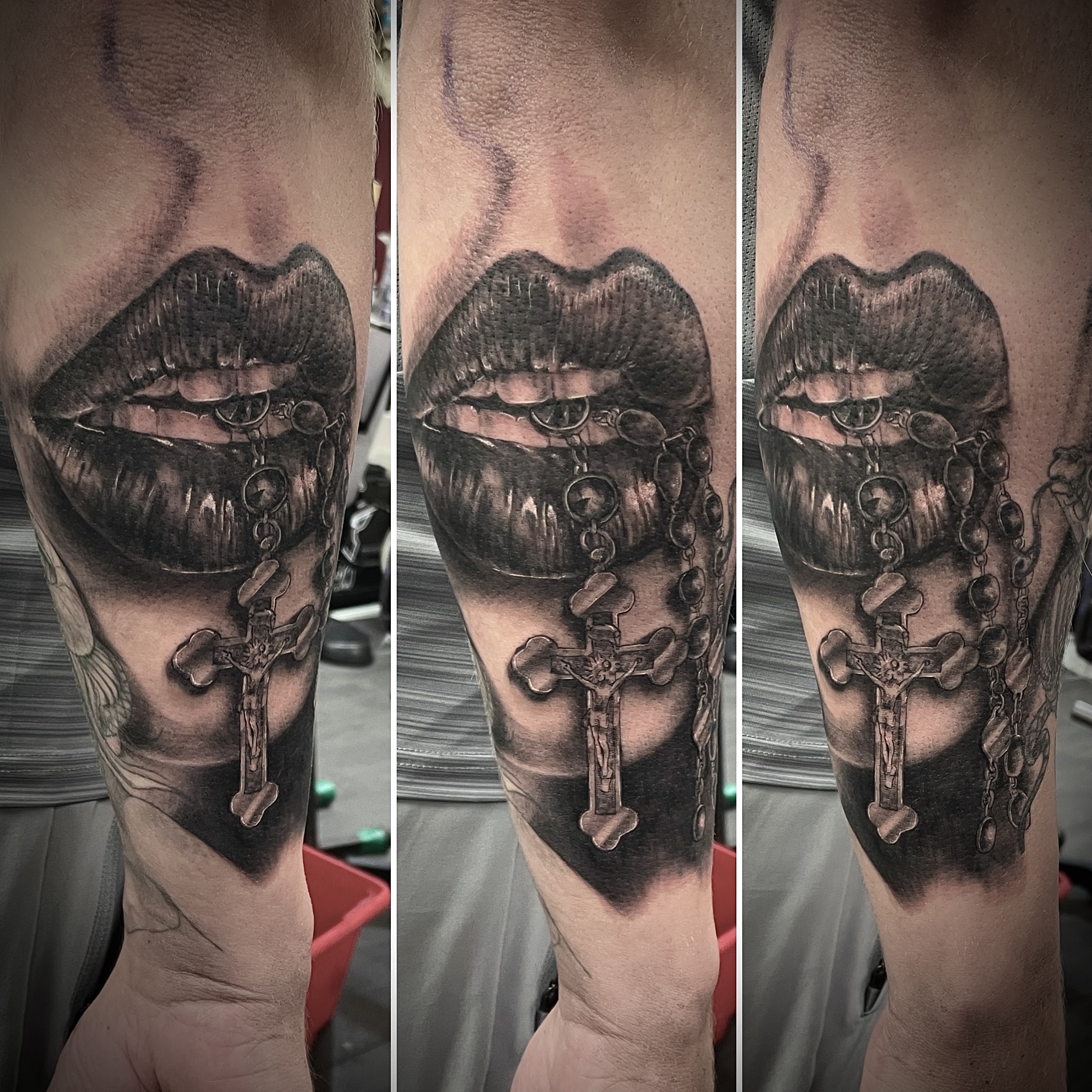 Black and grey realistic lips biting rosary beads with crucifix forearm piece by Matt