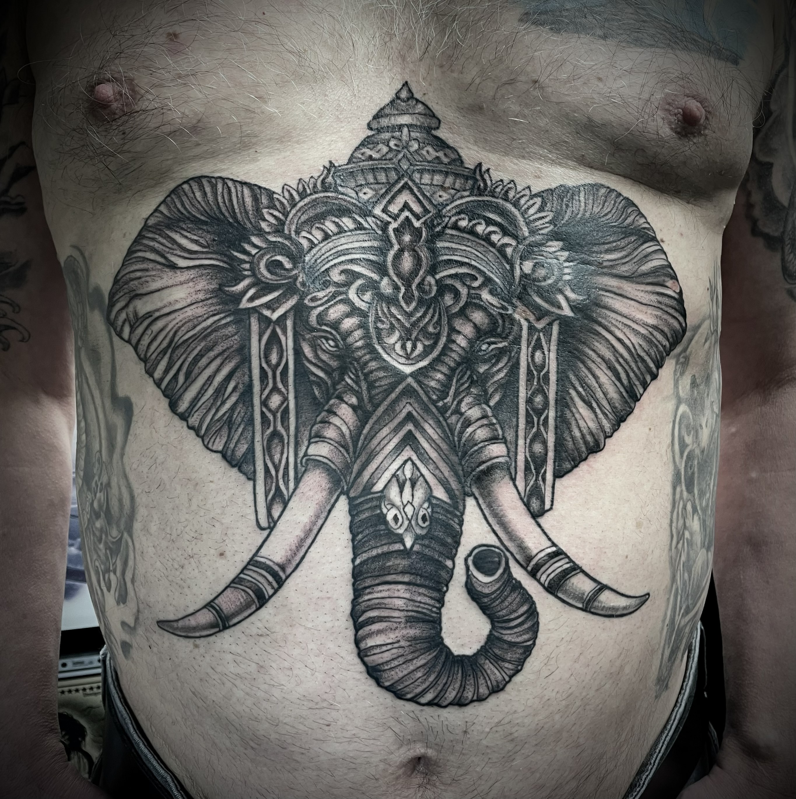 Black and grey ornamental elephant head with decorative headdress stomach piece by Matt