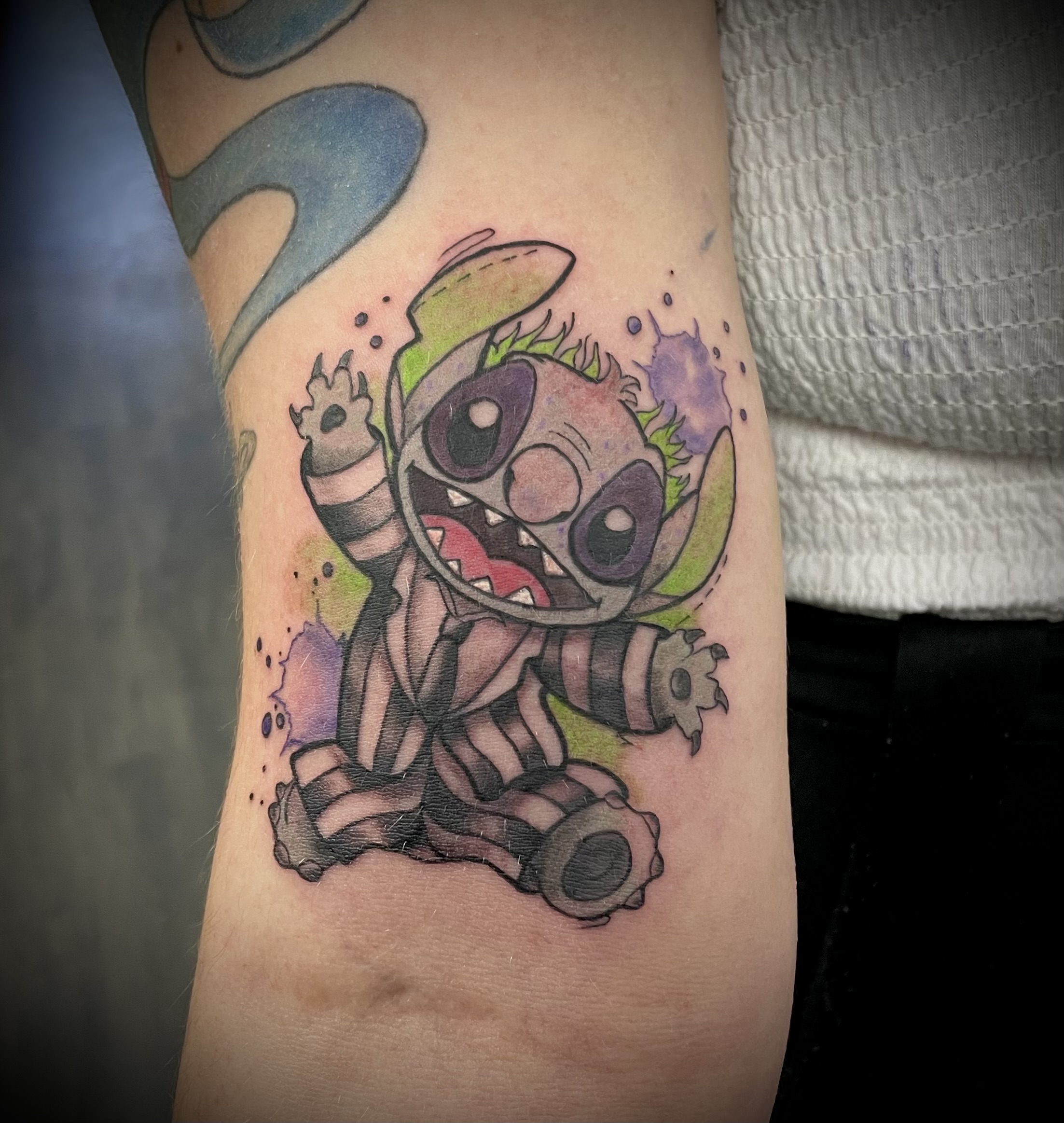 Colour Stitch dressed as zombie in watercolour splatter style by Matt