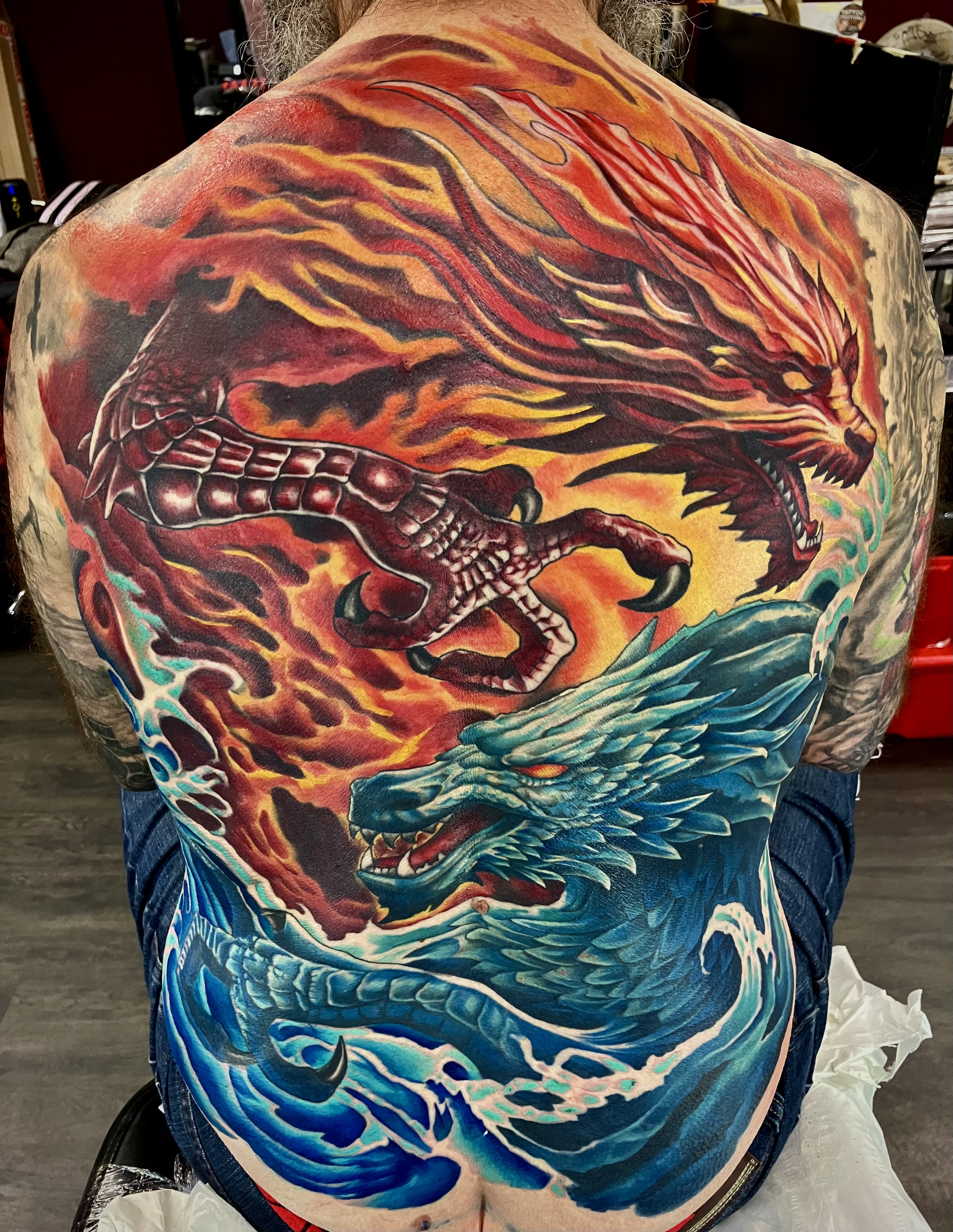 Fire dragon vs ice dragon full back piece in colour realism by Ray