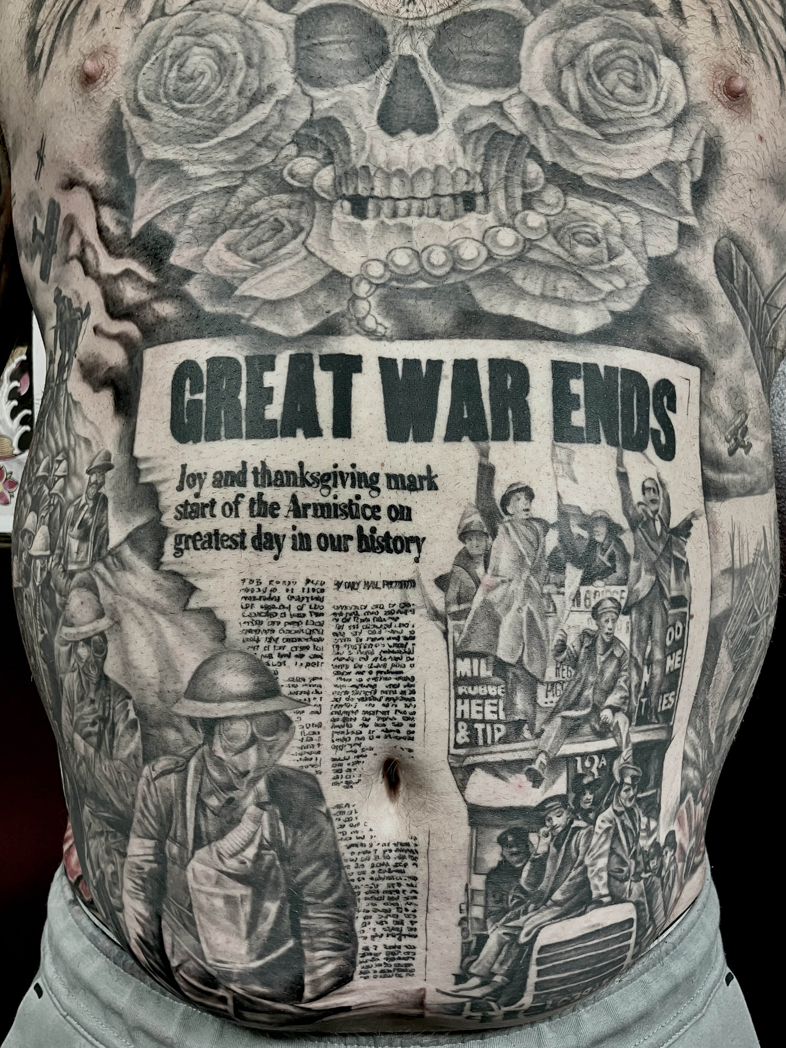 Black and grey WW1 Armistice newspaper front page torso piece with skull and roses by Ray
