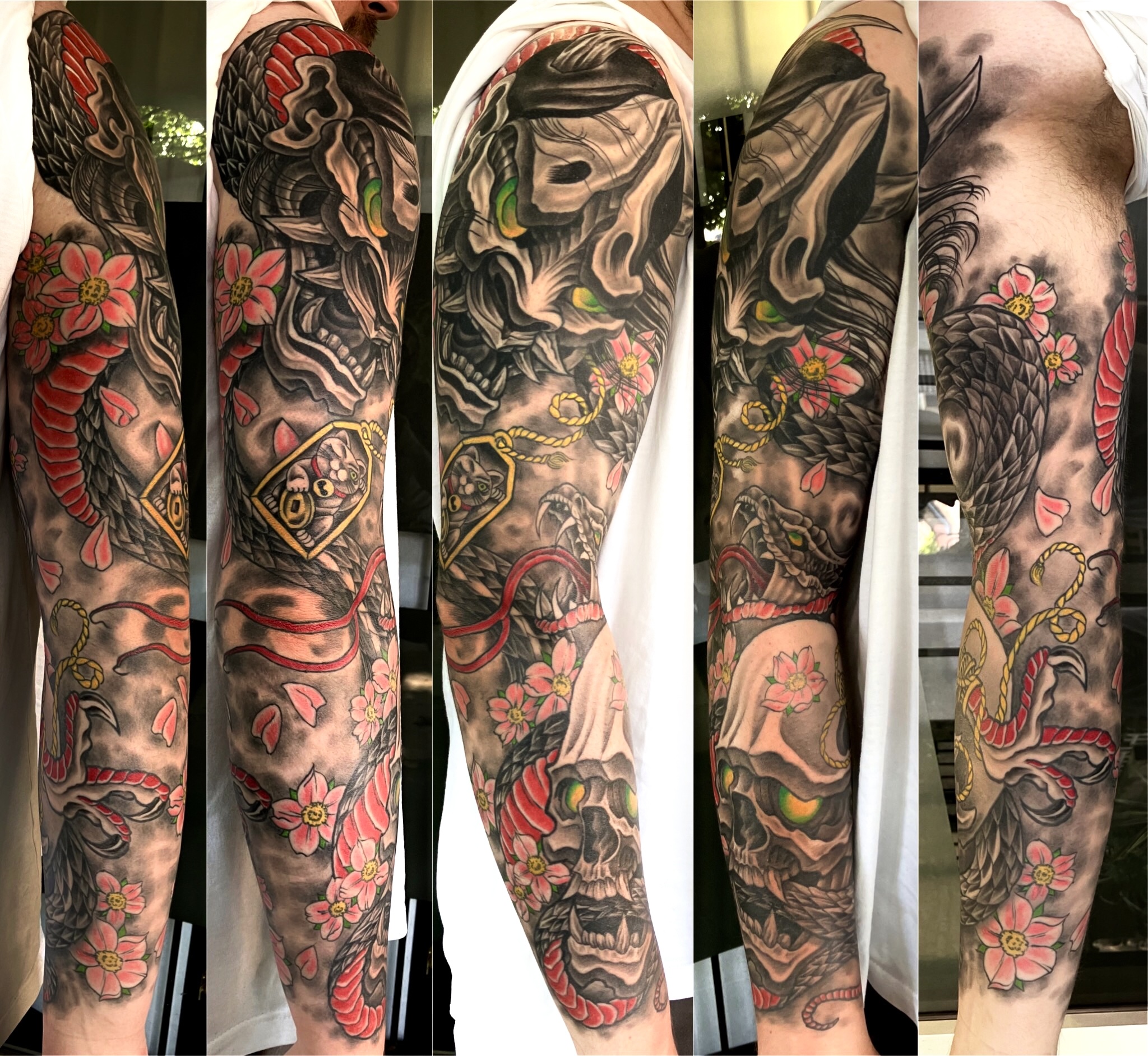 Japanese style full sleeve with hannya masks, cherry blossom and snake in black and grey with red accents by Ray