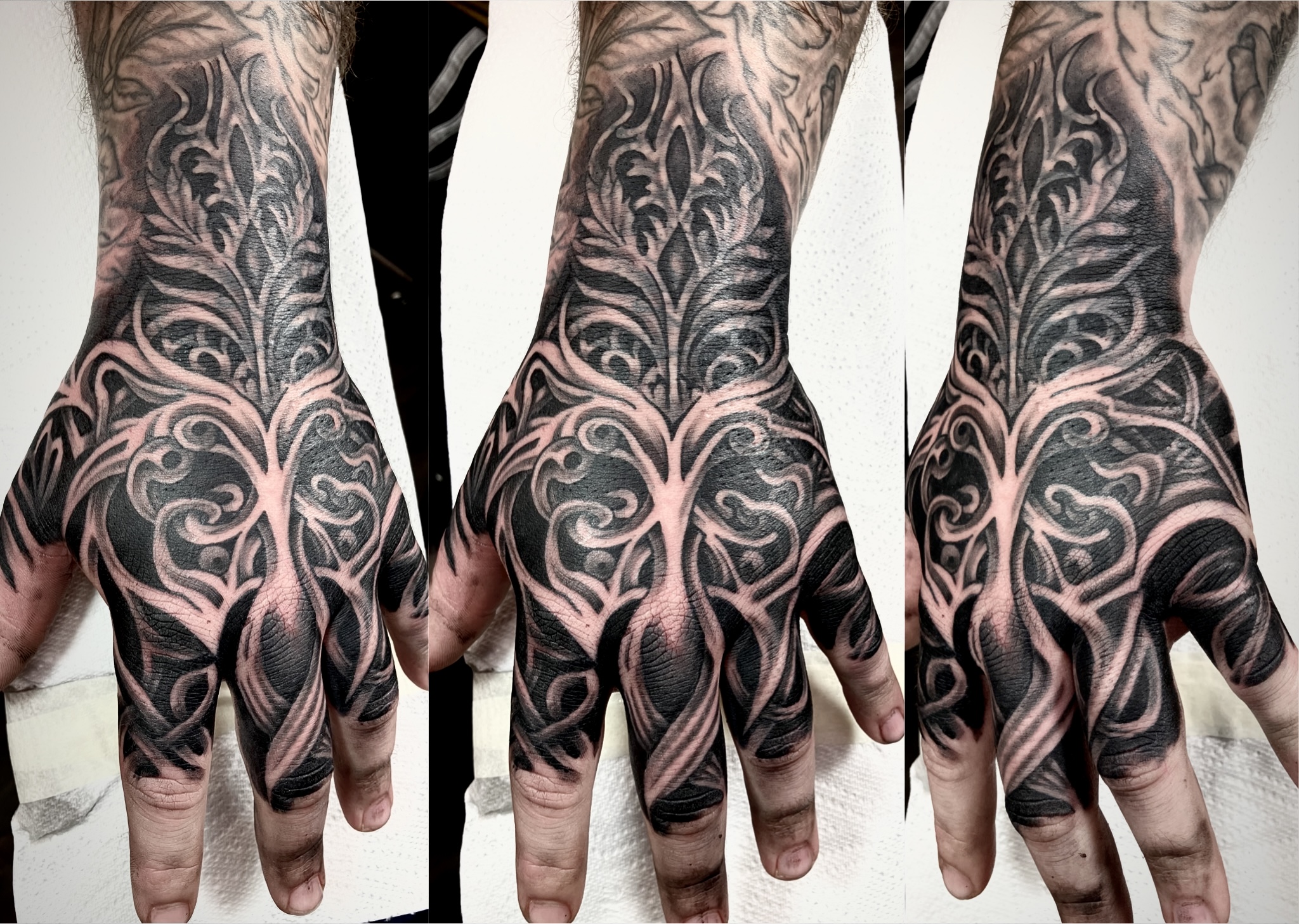 Black and grey ornamental filigree hand tattoo by Ray